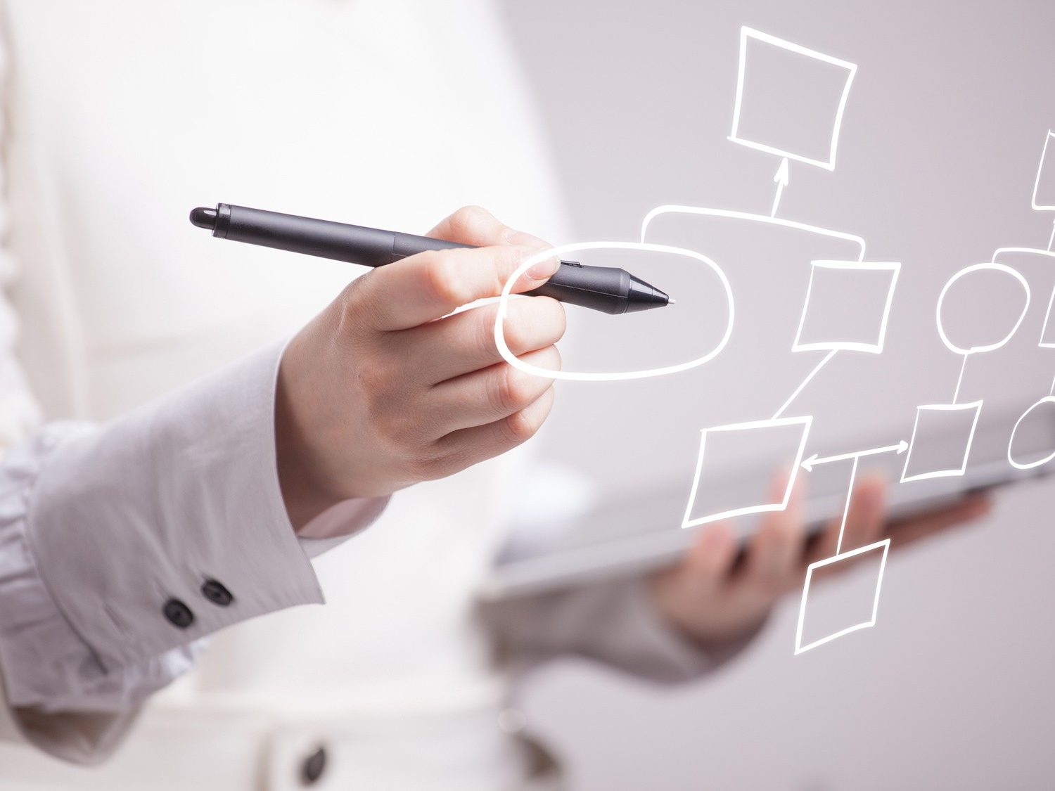 Businesswoman drawing flowchart, business process concept on grey background.