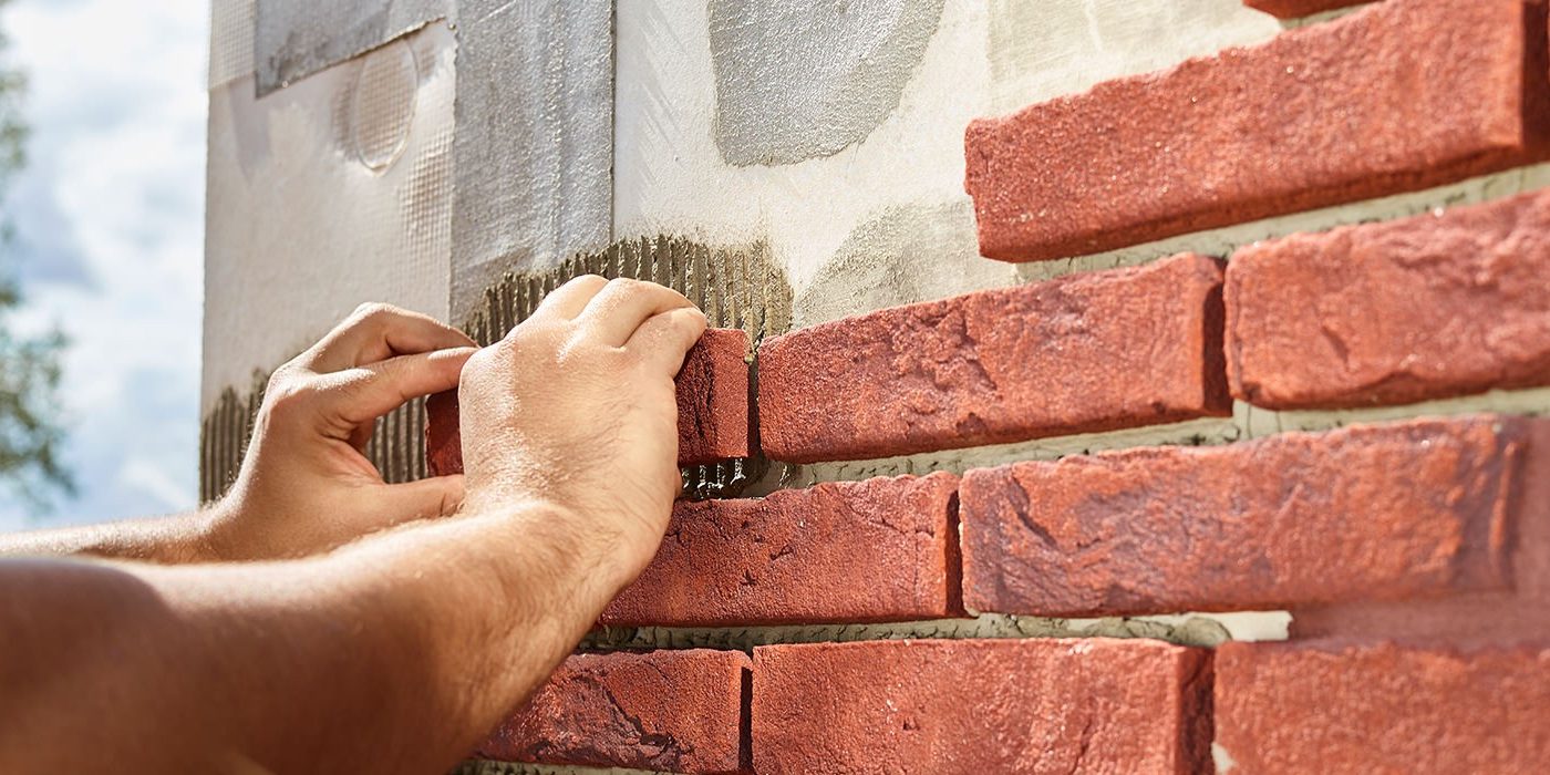 Installing brick slips on insulation panels
