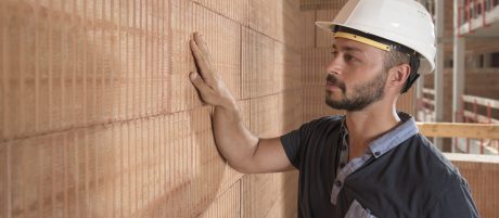Building professional touching brick block wall