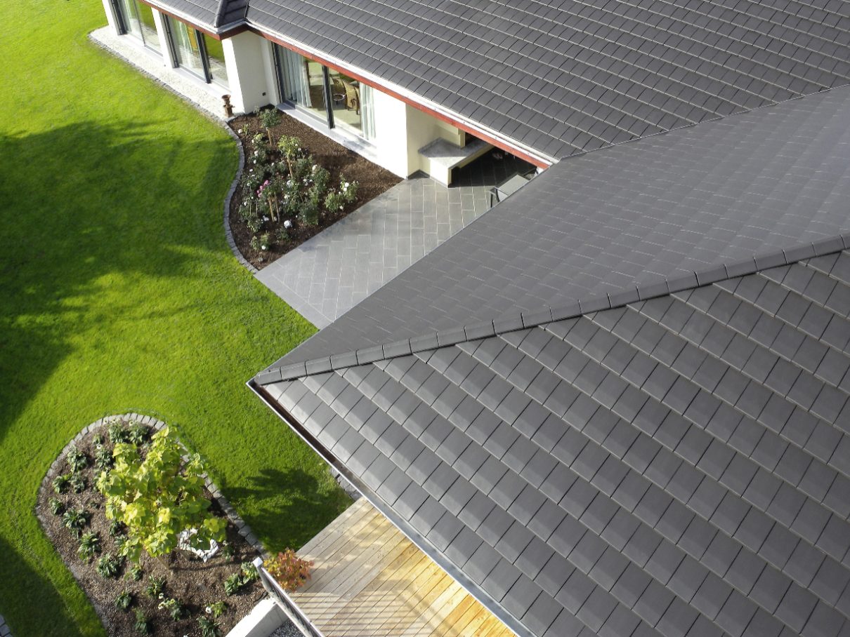 close up flat roof tiles noble graphite, aerial view