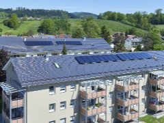 Multi-family house, bird's eye view, roof, solar system, balcony, meadow