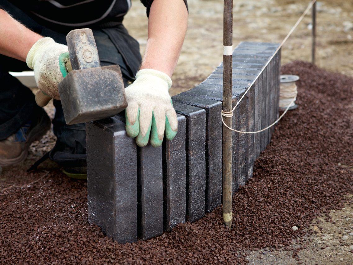 edge trim, border, string nail, cord, rubber hammer, construction worker, builder, gravel