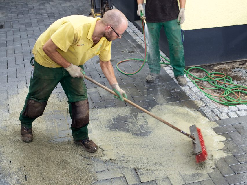 paver, penter, paving stone, brick, lay, laying, construction worker, broom, water, sand