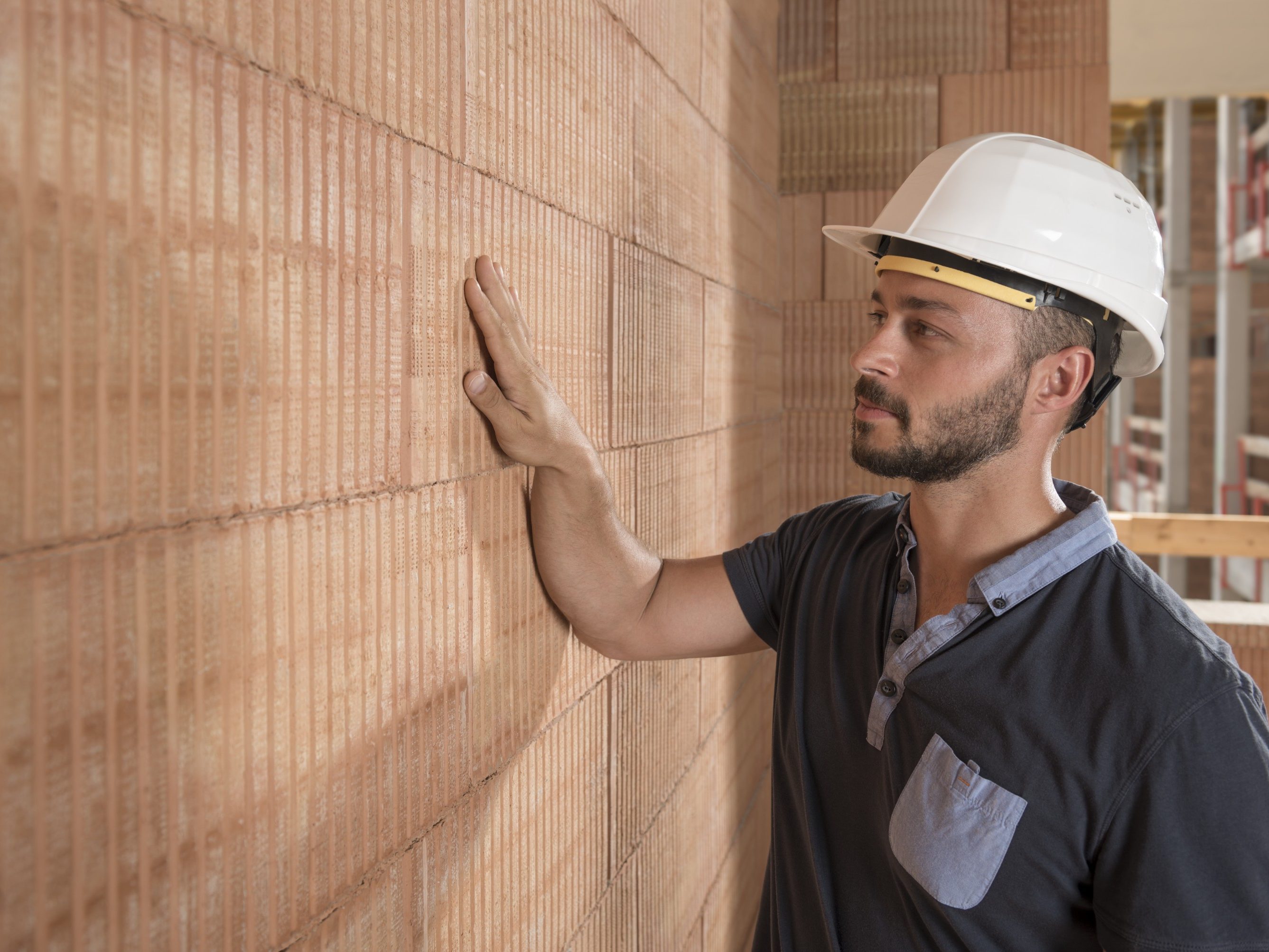 Building professional touching brick block wall