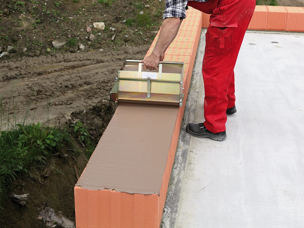 poroton, mortar, construction worker, mortar roll