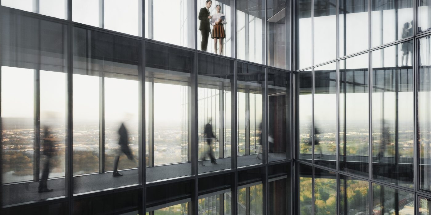 People walking on connecting bridges at Vienna Twin Towers
