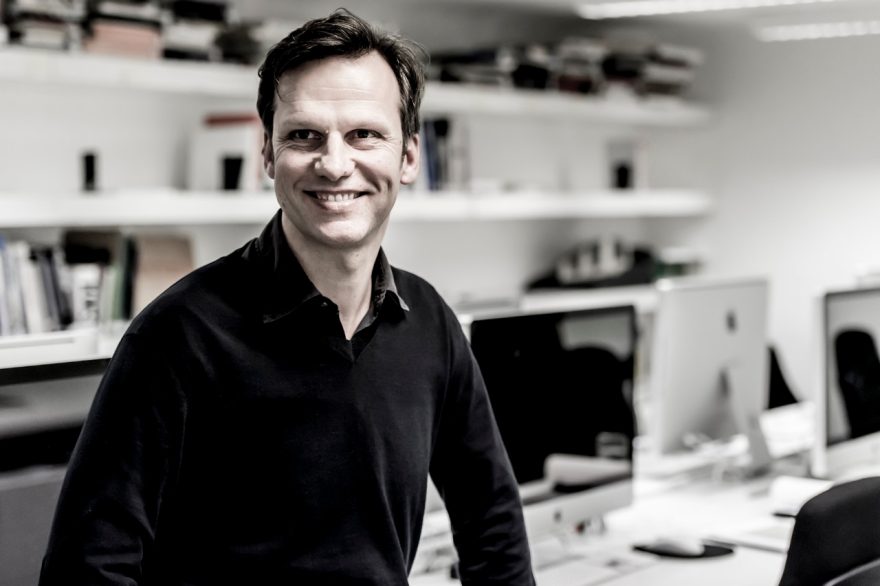 The picture shows a gentleman at his workplace