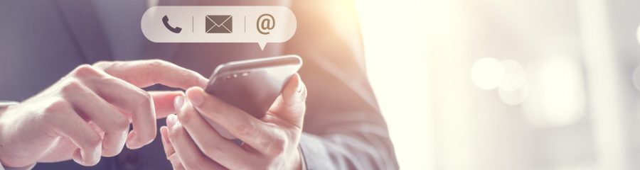 CONTACT US, Hand of Businessman holding mobile smartphone with ( mail,phone,email ) icon. customer support concept, copy space.
