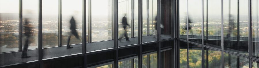 People walking on connecting bridges at Vienna Twin Towers