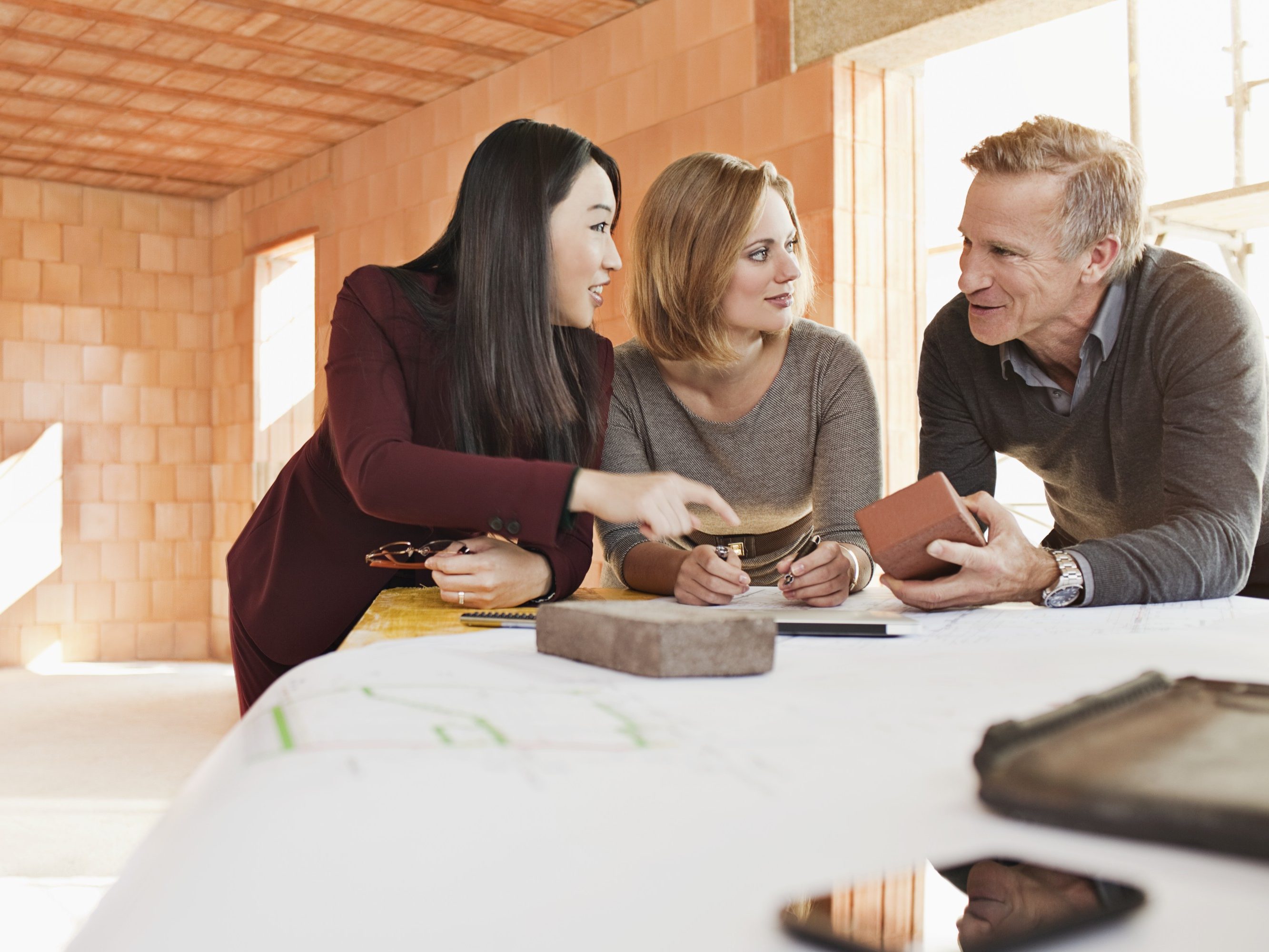 Group of people talking about building materials